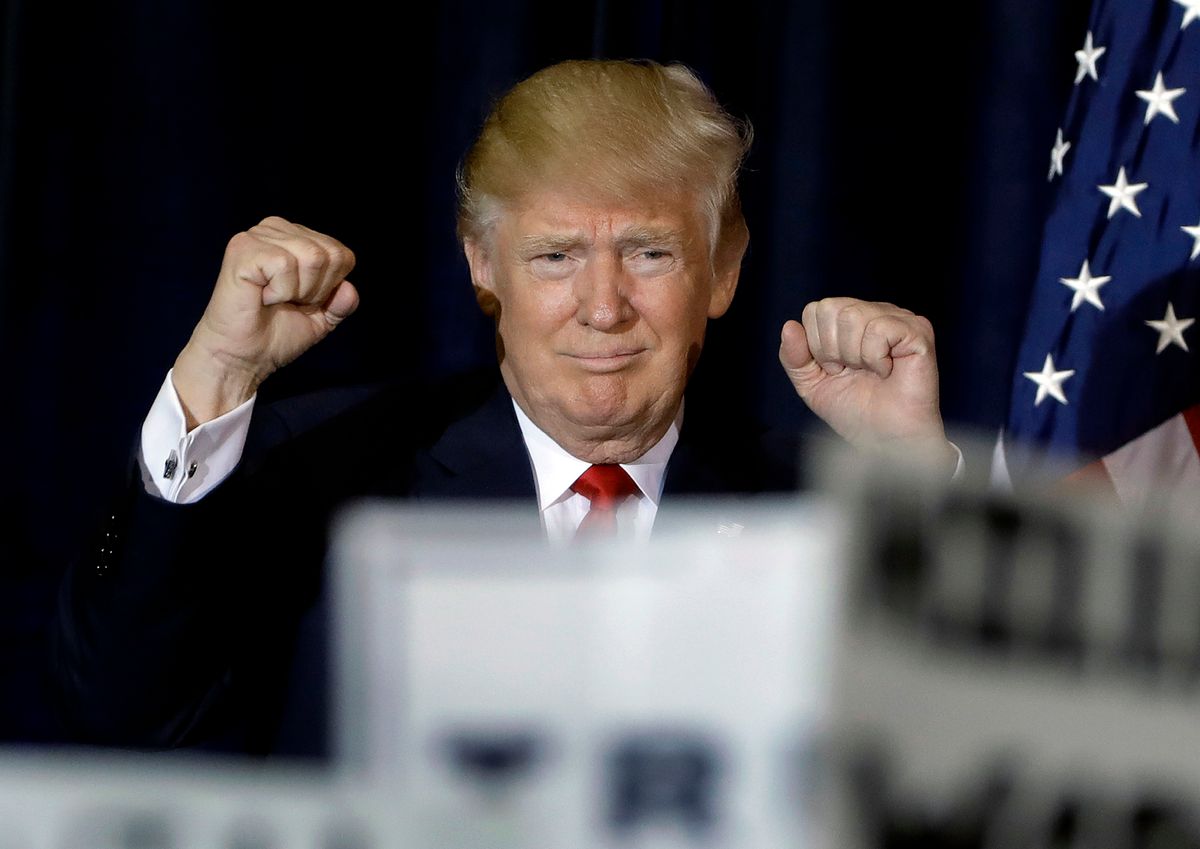 Republican presidential candidate Donald Trump pumps his fists as he takes the stage during a campaign rally Saturday, Nov. 5, 2016, in Tampa, Fla.  (AP)