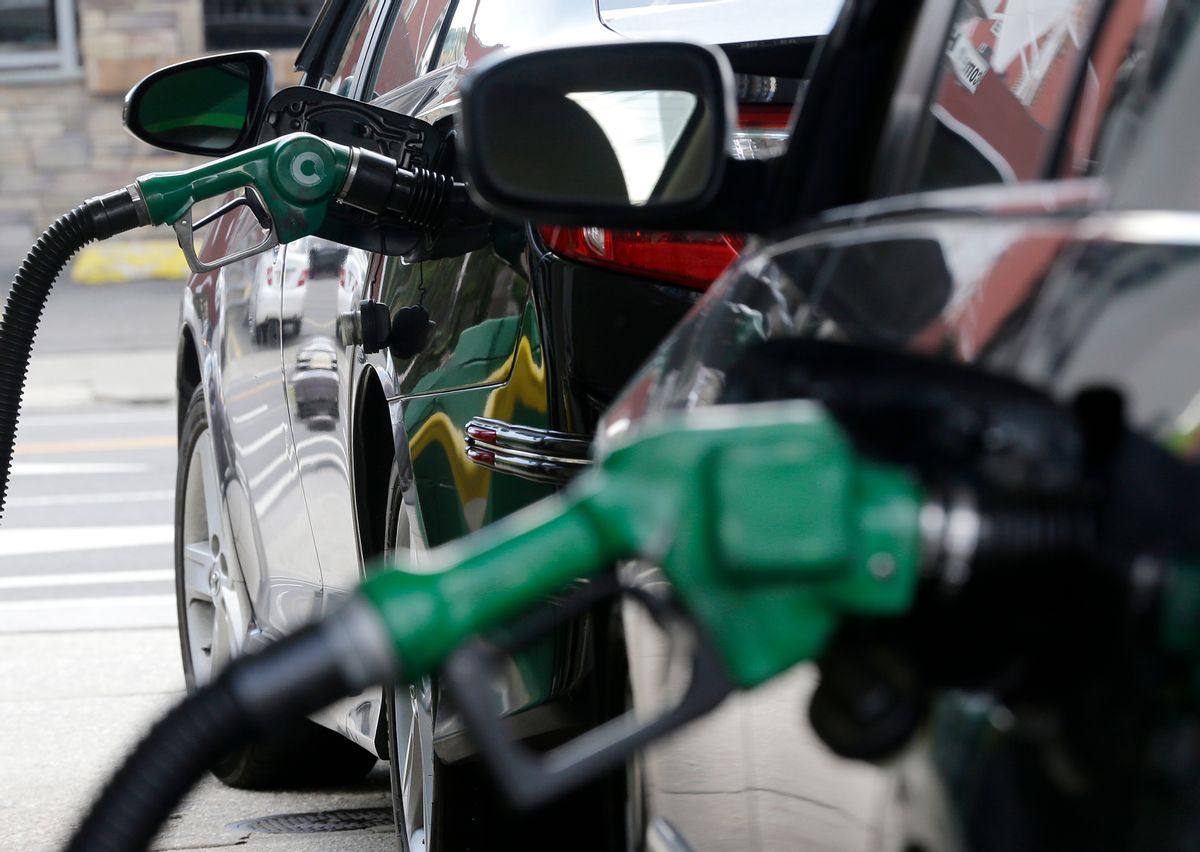 FILE - In this June 30, 2016, file photo, gas is pumped into vehicles at a BP gas station in Hoboken, N.J. The Obama administration has decided not to change government fuel economy requirements for cars and light trucks despite protests from automakers. (AP Photo/Julio Cortez, File) (AP)