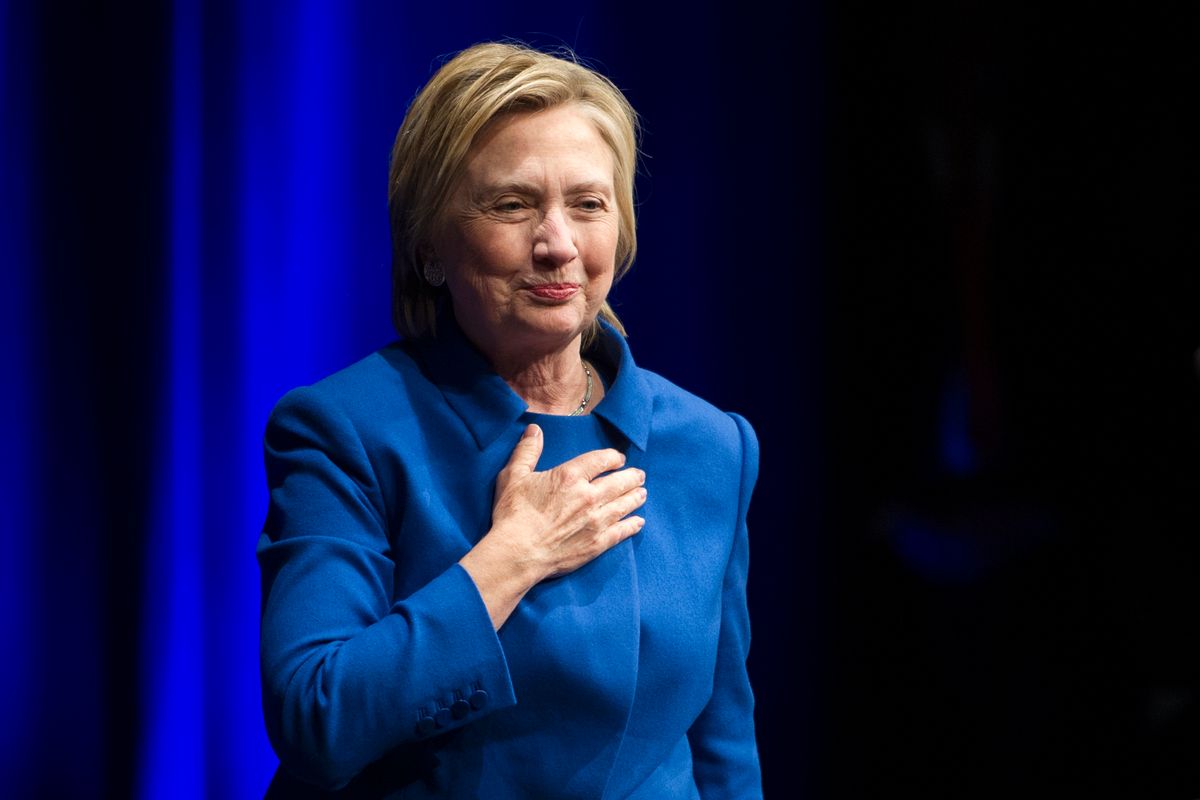 Hillary Clinton places her hand over her hand as she walks to the podium to address the Children's Defense Fund's Beat the Odds celebration at the Newseum in Washington, Wednesday, Nov. 16, 2016.  (AP)