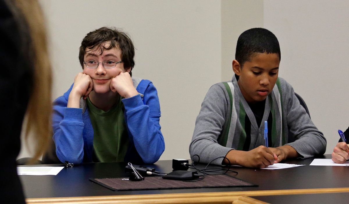 Petitioners Gabe Mandell, 14, left, and Adonis Williams, 12, look on as an attorney speaks at a court hearing Tuesday, Nov. 22, 2016, in Seattle. Eight children are asking a Seattle judge to find Washington state in contempt for failing to adequately protect them and future generations from the harmful effects of climate change, part of a nationwide effort by young people to try to force action on global warming. (AP Photo/Elaine Thompson) (AP)