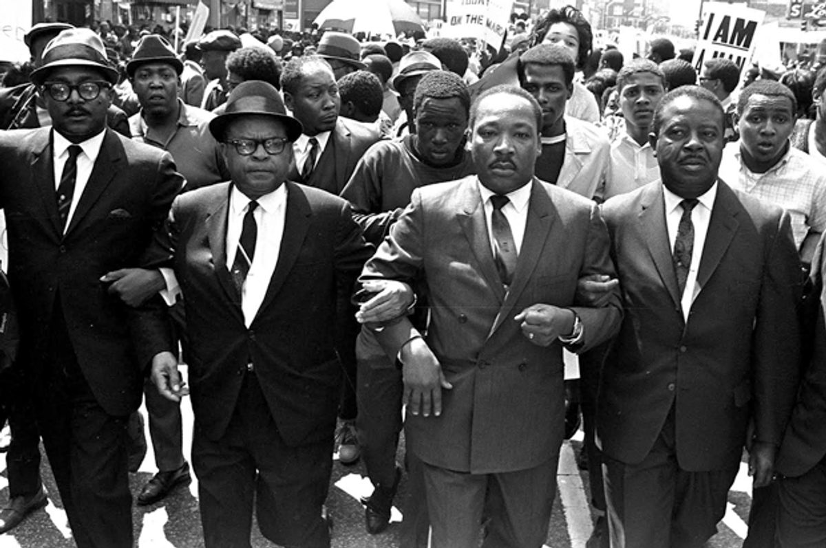 The Rev. Ralph Abernathy, right, and Bishop Julian Smith, left, flank Dr. Martin Luther King, Jr., during a civil rights march in Memphis, Tenn., March 28, 1968.    (AP/Jack Thornell)