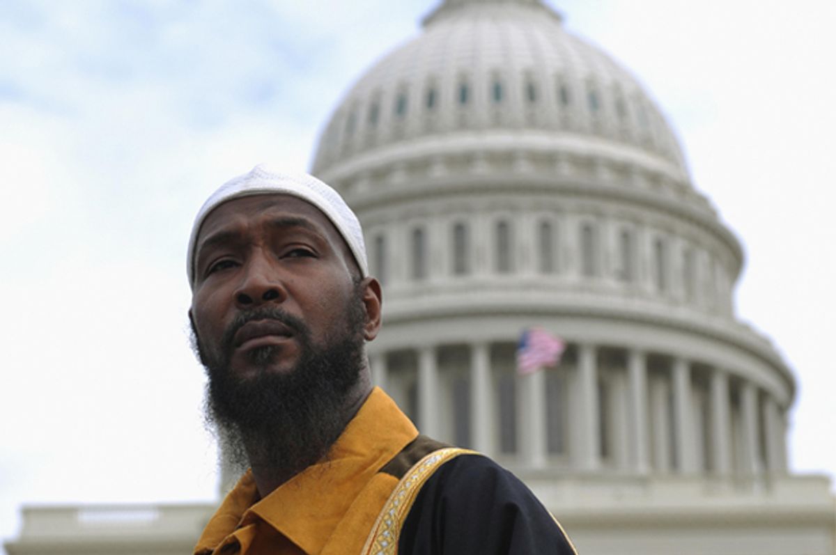 A Muslim man in front ot the dome of the U.S. Capitol during a prayer event  (Getty/Mandel Ngan)