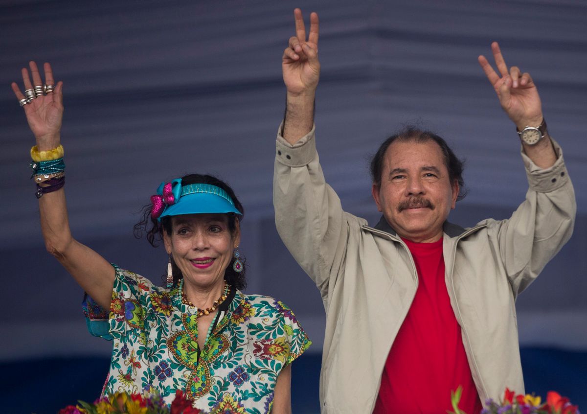 FILE.- In this July 3, 2016 file photo Nicaragua's President Daniel Ortega, right, and first lady Rosario Murillo, wave to supporters during an event commemorating the 36th anniversary of the Sandinista National Liberation Front withdrawal to Masaya, in Managua, Nicaragua. Murillo now running as her husband's VP ticket mate in a Nov. 6 election seen as a shoo-in and is poised to finally have the title to match her true influence. (AP Photo/Esteban Felix, File) (AP)