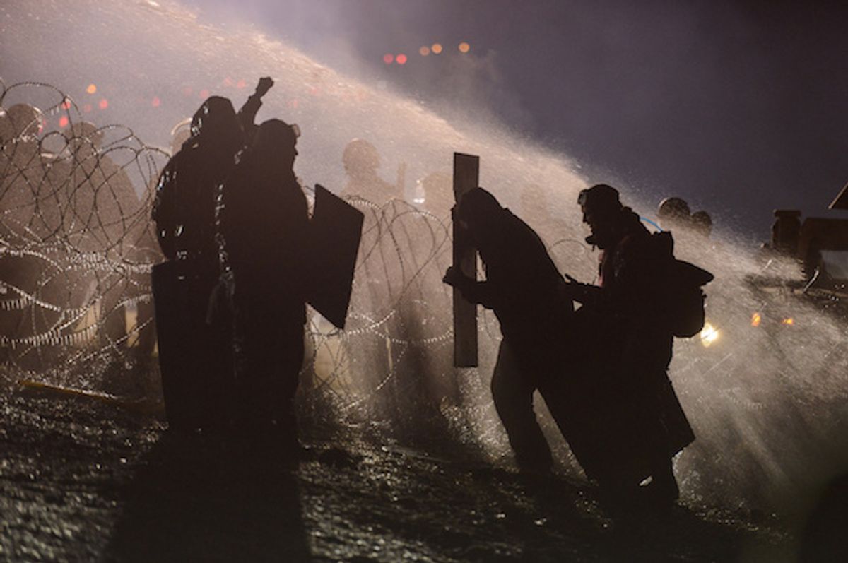 Police use a water cannon against Dakota Access pipeline protesters in the freezing cold, near the Standing Rock Indian Reservation, North Dakota, November 20, 2016  (Reuters/Stephanie Keith)