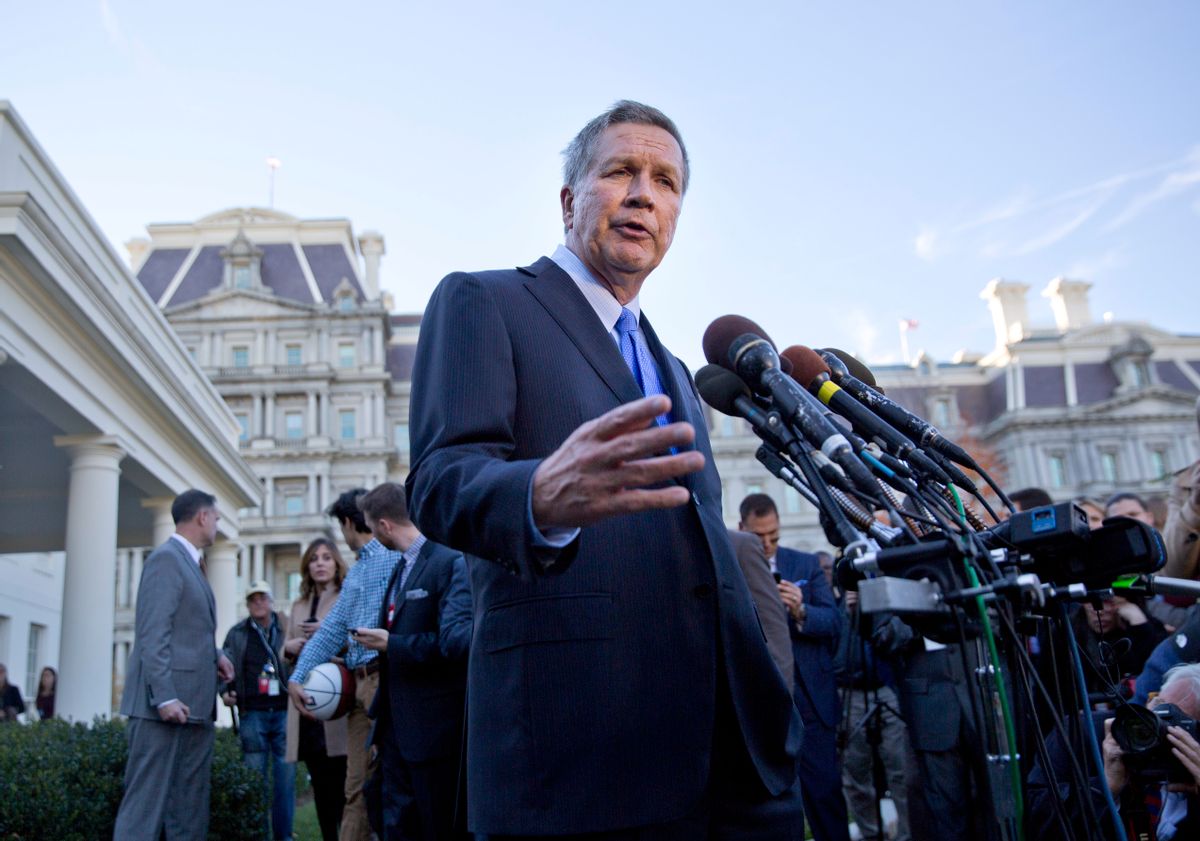 Ohio Gov. John Kasich answers questions from members of the media outside the West Wing of the White House in Washington, Thursday, Nov. 10, 2016, after attending a ceremony on the South Lawn where President Barack Obama honored the 2016 NBA champion Cleveland Cavaliers basketball team. (AP Photo/Pablo Martinez Monsivais) (AP)