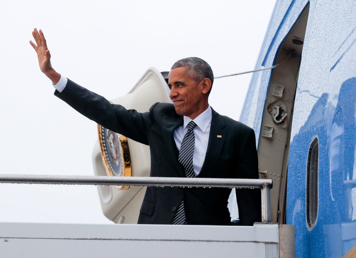 US President Barack Obama waves as he boards Air Force One during his departure from Tegel International Airport in Berlin, Friday, Nov. 18, 2016. (AP)