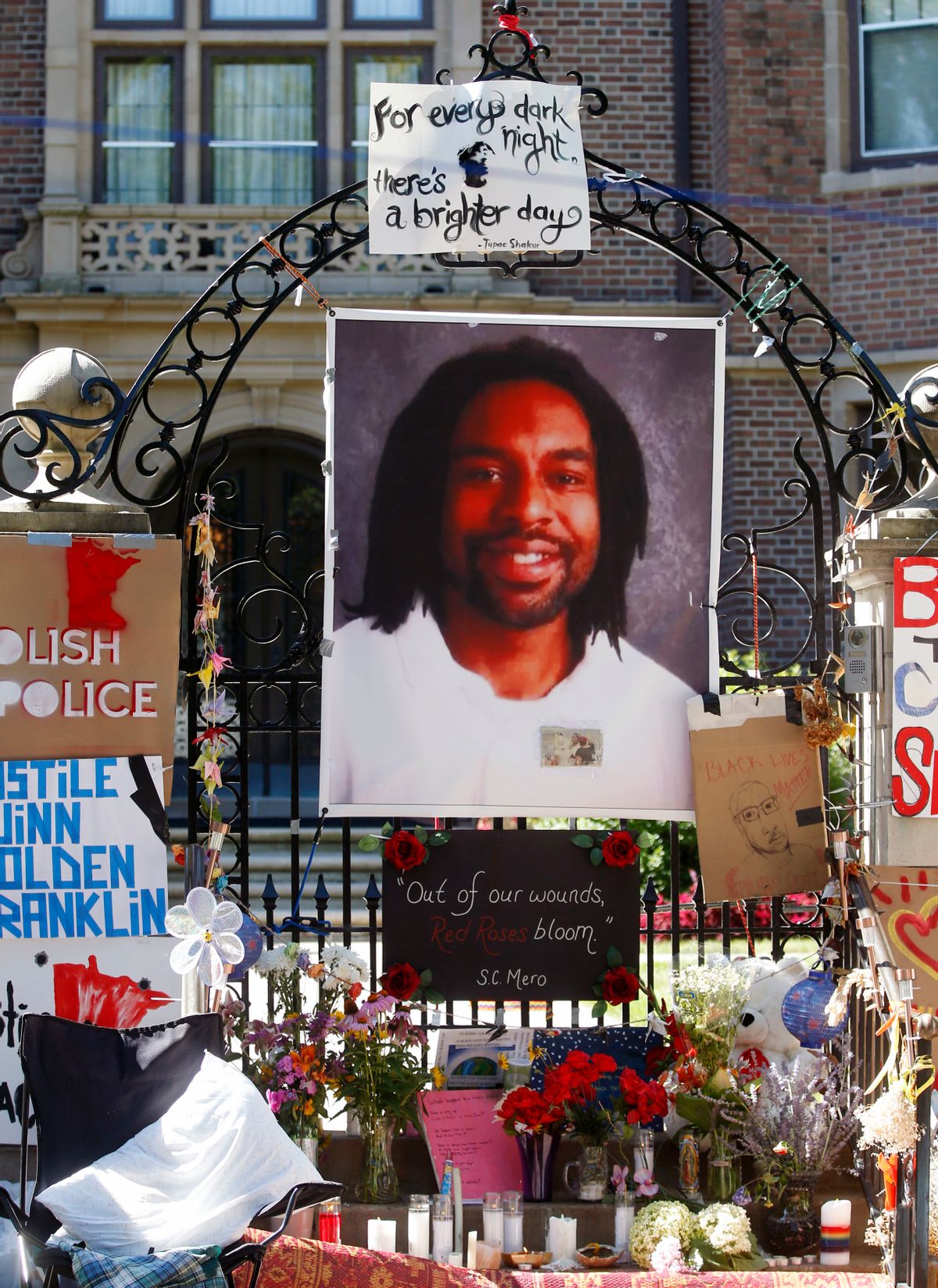 FILE - In this July 25, 2016, file photo, a memorial including a photo of Philando Castile adorns the gate to the governor's residence where protesters continue to demonstrate in St. Paul, Minn., against the July 6 shooting death of Castile by St. Anthony police officer Jeronimo Yanez during a traffic stop in Falcon Heights, Minn. Prosecutors announced Wednesday, Nov. 16, 2016, that Yanez has been charged with second-degree manslaughter in the killing. (AP Photo/Jim Mone, File) (AP)