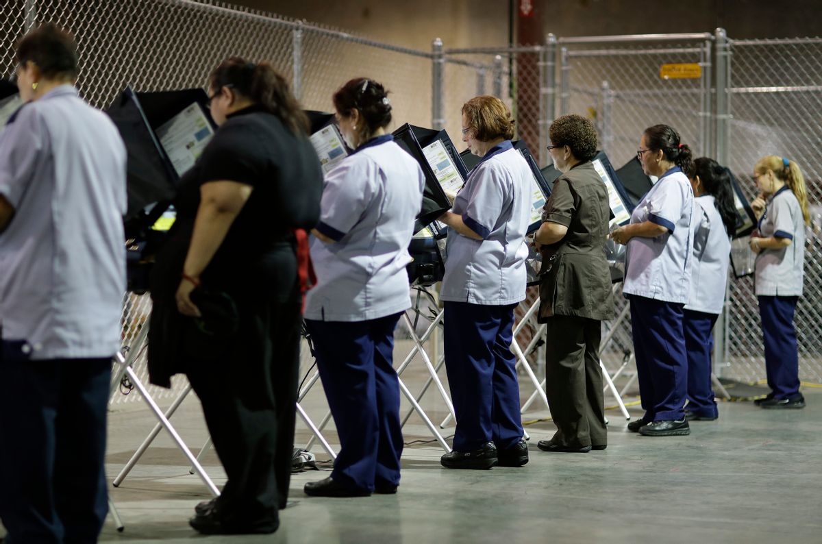 In this Oct. 26, 2016, photo, casino workers vote at an early voting site in Las Vegas.  With Election Day approaching, many small businesses want to make it easy for staffers to vote. So they’re giving them flex time, balloting breaks or are opening several hours late. (AP Photo/John Locher) (AP)