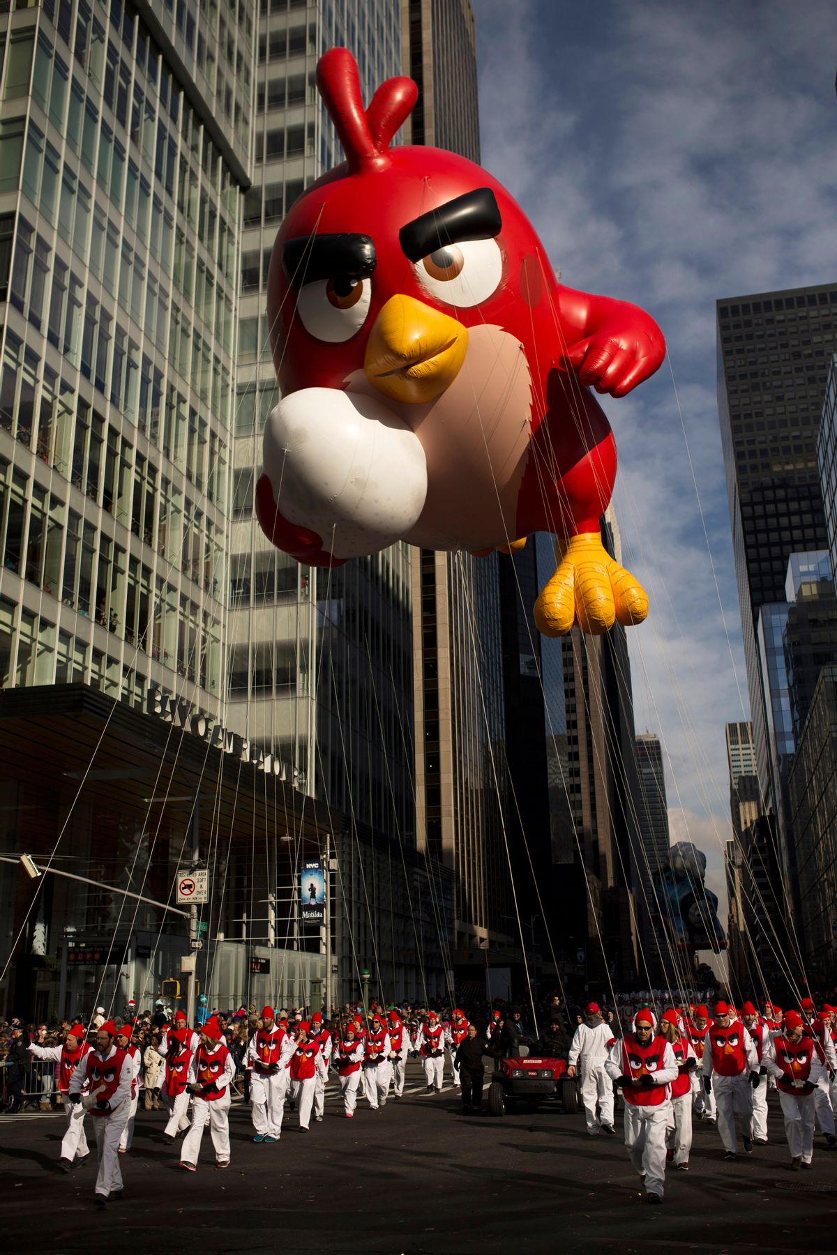 FILE - In this Thursday, Nov. 26, 2015, file photo, the balloon Angry Bird is moved through Sixth Avenue during the Macy's Thanksgiving Day Parade in New York. A giant Charlie Brown balloon will join 1,000 clowns and a dozen marching bands along a parade route lined with spectators and police in plainclothes for the 90th annual parade. (AP Photo/Andres Kudacki, File) (AP)
