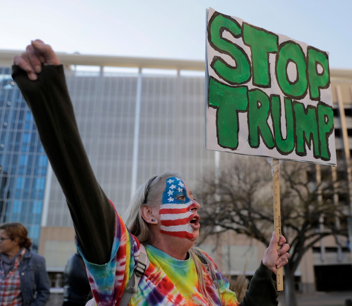 Mary Johnson protests against the election of President-elect Donald Trump Saturday, Nov. 12, 2016, in front of City Hall in Kansas City, Mo.  (AP)