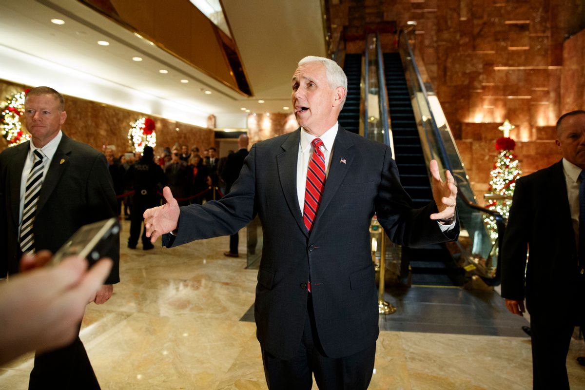Vice President-elect Mike Pence talks with reporters as he leaves Trump Tower, Monday, Nov. 28, 2016, in New York. (AP Photo/Evan Vucci) (AP)