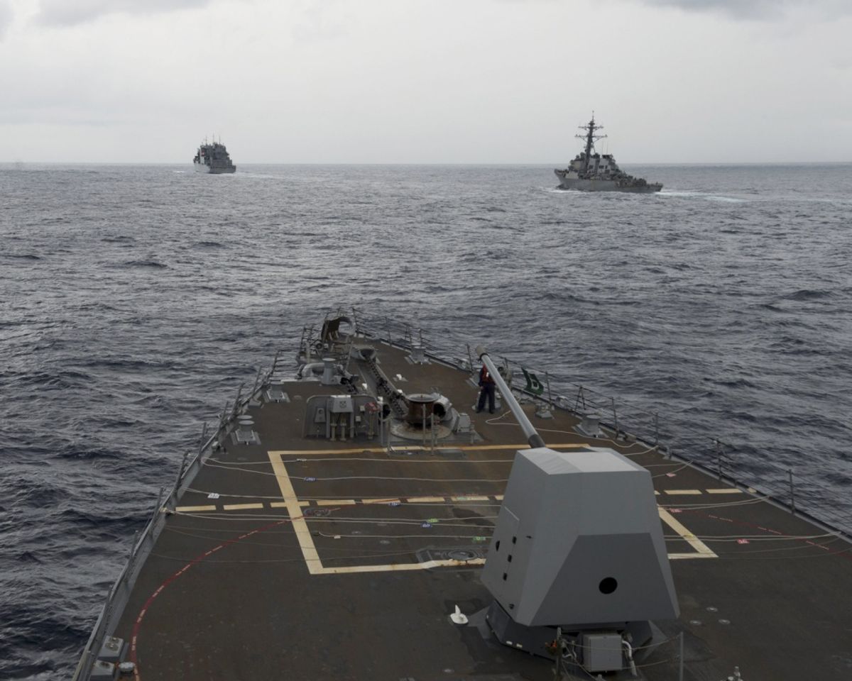 FILE - This Oct. 17, 2016 file image provided by the U.S. Navy,  shows the guided missile destroyer USS Decatur, right, pulling into position behind the Military Sealift Command USNS Matthew Perry, during a replenishment-at-sea, seen from the bridge of the guided-missile destroyer USS Spruance, in the South China Sea. The commander of U.S. forces in the Pacific Adm. Harry Harris said he’s concerned with China’s assertiveness in the South China Sea and the East China Sea as he headed to the Philippines to discuss the next round of joint exercises. (U.S. Navy/Petty Officer 2nd Class Will Gaskill via AP, File) (AP)
