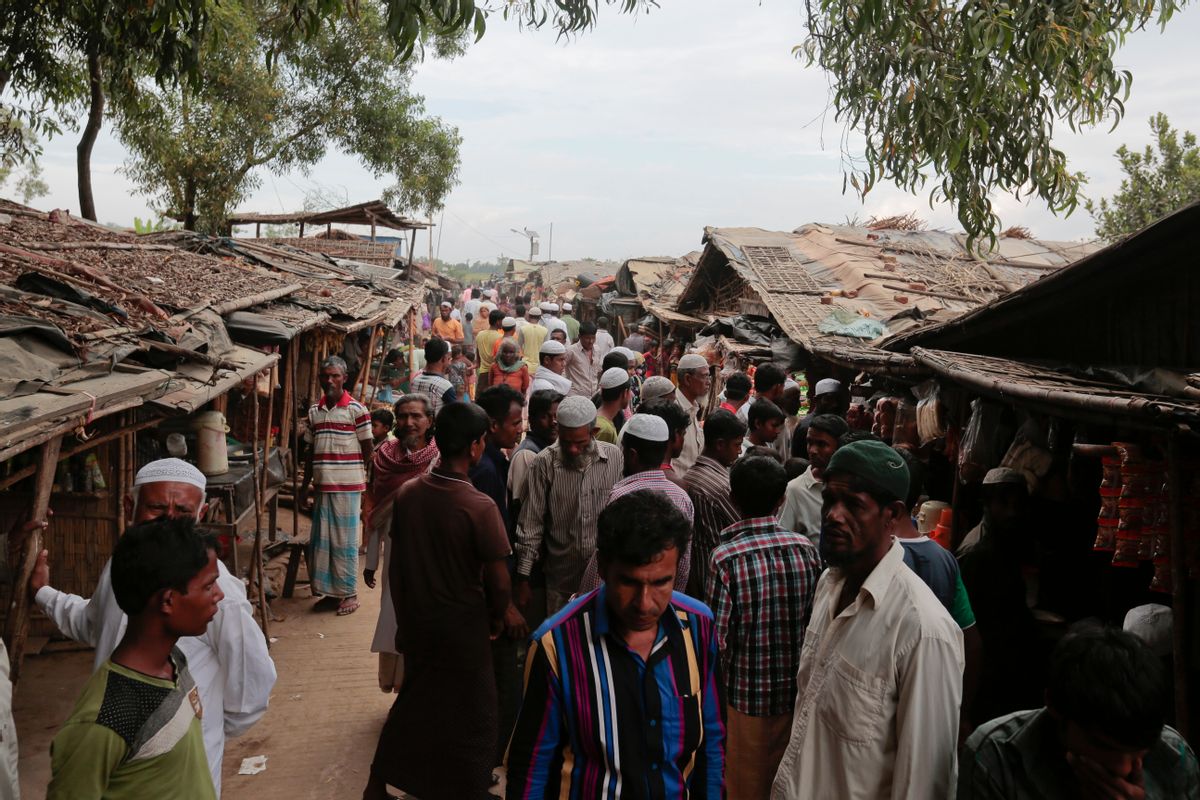 Rohingya from Myanmar make their way in an alley at an unregistered refugee camp in Teknaf (AP Photo/A.M. Ahad)