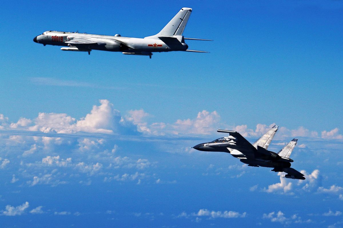 FILE - In this Sept. 25, 2016 file photo released by Xinhua News Agency, Chinese People's Liberation Army Air Force Su-30 fighter, right, flies along with a H-6K bomber as they take part in a drill near the East China Sea. China patrolled the waters of a series of hotly contested islands on Sunday, Dec. 11, 2016, a day after staging a flyover of two strategically important waterways near Taiwan and Japan.  (AP)