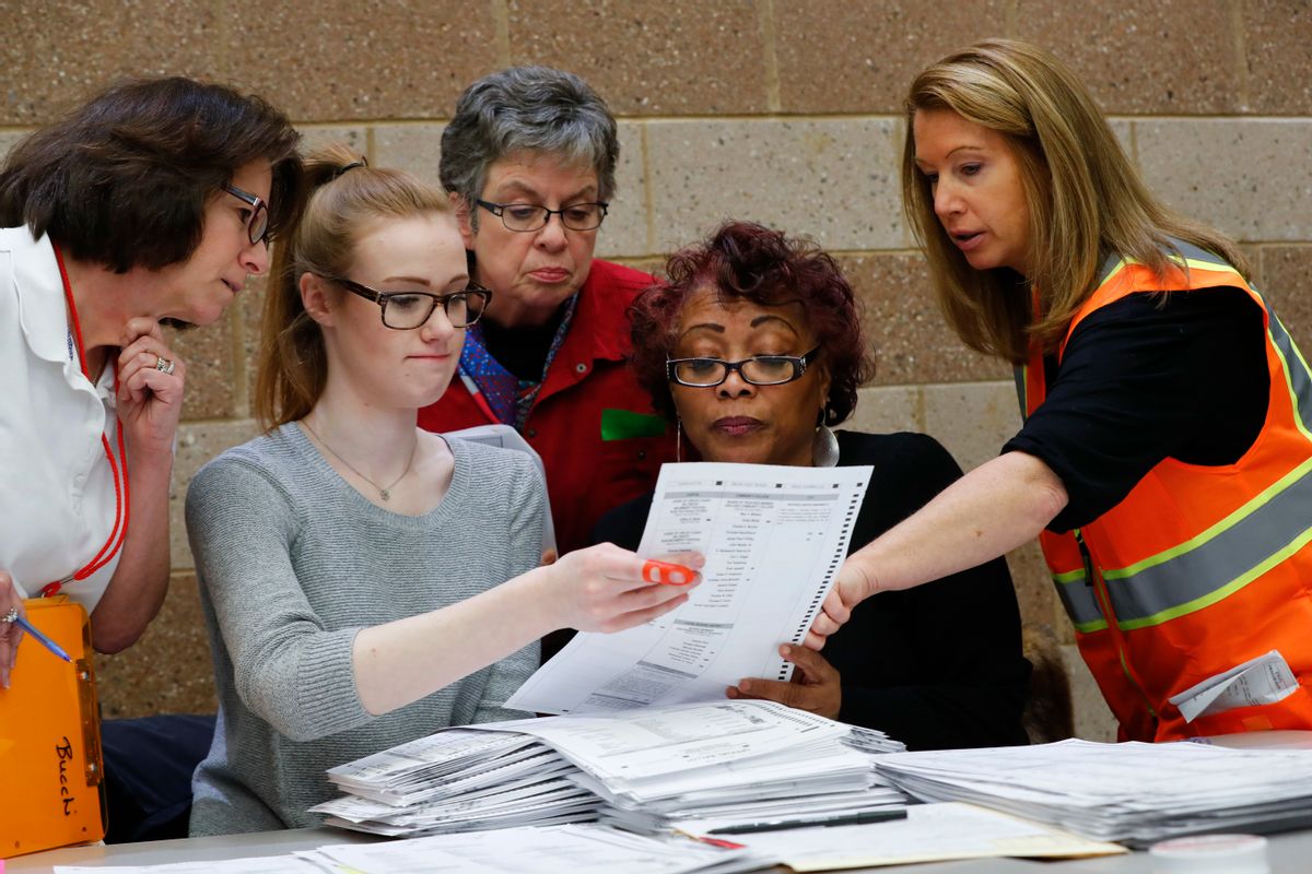A challenge is reviewed on a ballot during a statewide presidential election recount in Waterford Township, Mich., Monday, Dec. 5, 2016. The recount comes at the request of Green Party candidate Jill Stein who also requested recounts in Pennsylvania and Wisconsin. (AP Photo/Paul Sancya) (AP Photo/Paul Sancya)