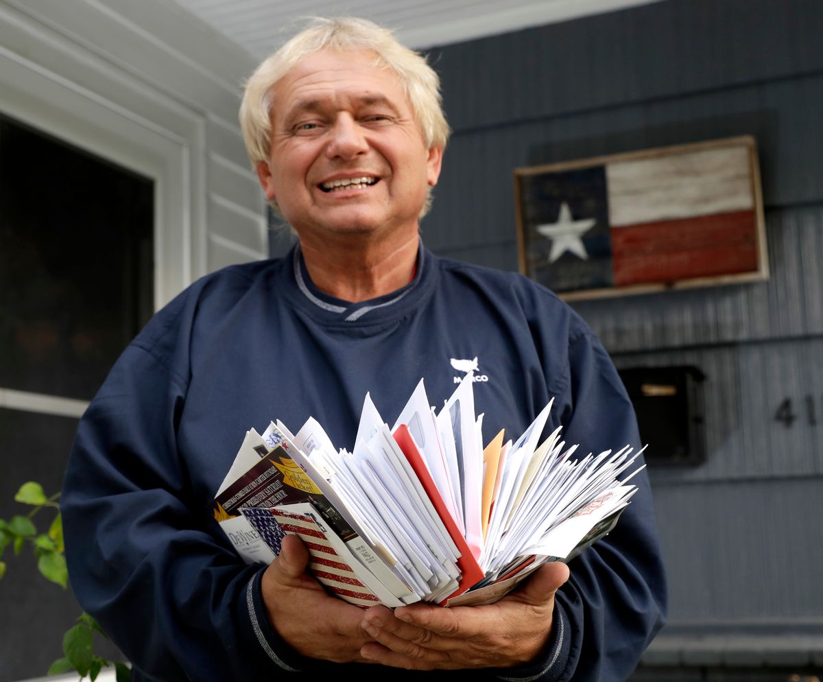 Rex Teter, a member of the Electoral College, holds two days of delivered mail at his home in Pasadena, Texas, Tuesday, Dec. 13, 2016. And you thought Election Day was in November. Electors are gathering in every state Dec, 19, to formally elect Donald Trump president even as anti-Trump forces try one last time to deny him the White House. Republican electors say they have been deluged with emails, phone calls and letters urging them not to support Trump. Many of the emails are part of coordinated campaigns. (AP Photo/David J. Phillip) (AP)