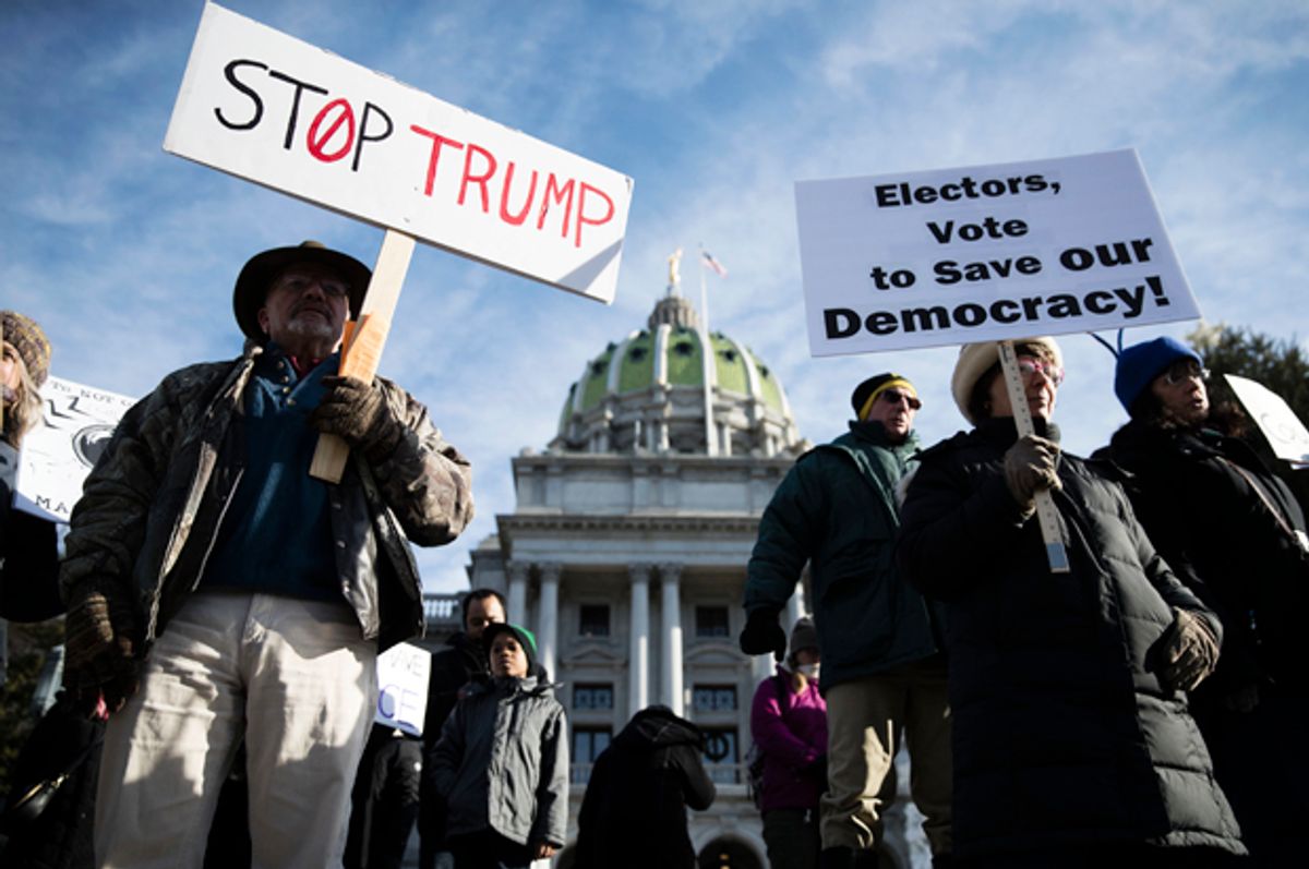 Protesters demonstrate ahead of Pennsylvania's 58th Electoral College at the state Capitol in Harrisburg, Pa., Monday, Dec. 19, 2016.   (AP/Matt Rourke)