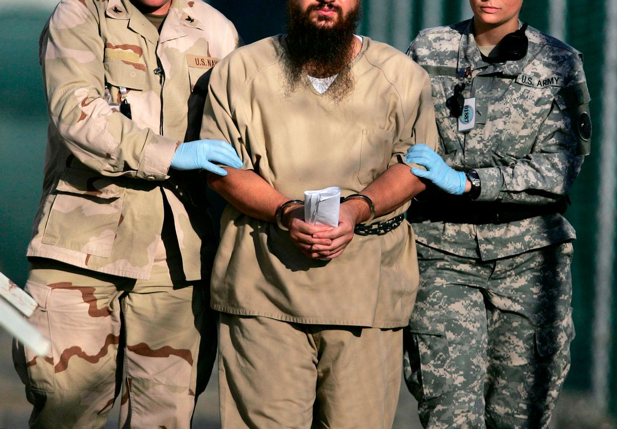 A shackled detaineein Guantanamo   (AP/Brennan Llinsley)