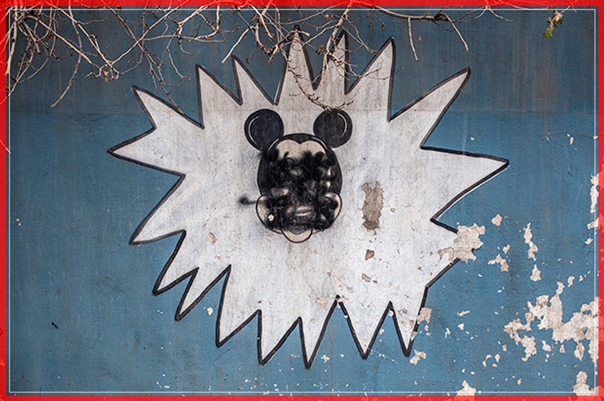This Sunday, Dec. 18, 2016 photo shows a drawing of Mickey Mouse with its face painted over by Islamic States militants on the wall of a kindergarten n the al-Barid district in Mosul, Iraq. In a part of Mosul that had been reclaimed from the Islamic State group (IS) days ago, Iraqi special forces were attacked on Sunday by drones operated by IS fighters inside the city.(AP Photo/Manu Brabo) (AP)