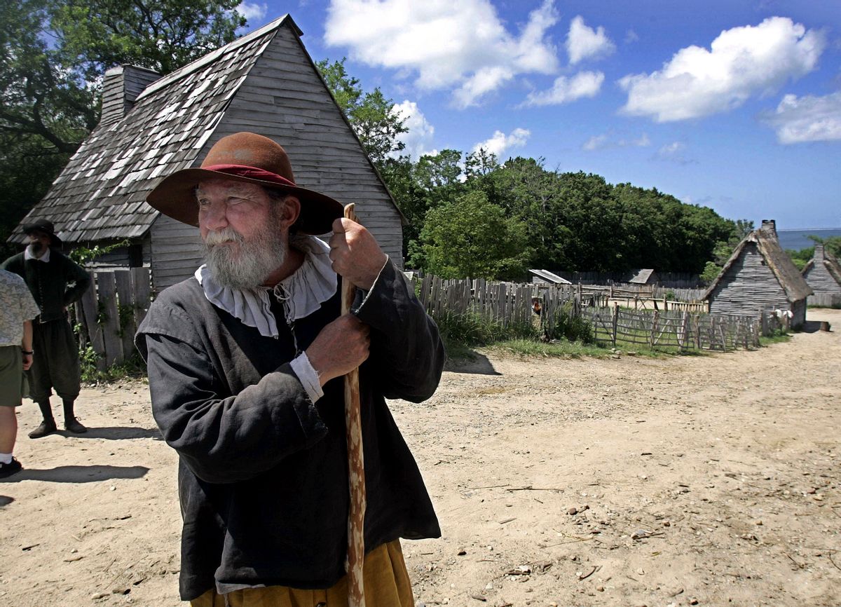 This June 27, 2006, file photo, shows a 17th century costumed role player, who called himself Samuel Fuller, in a 1627 Pilgrim Village at Plimoth Plantation in Plymouth, Mass.  (AP Photo/Chitose Suzuki, File)