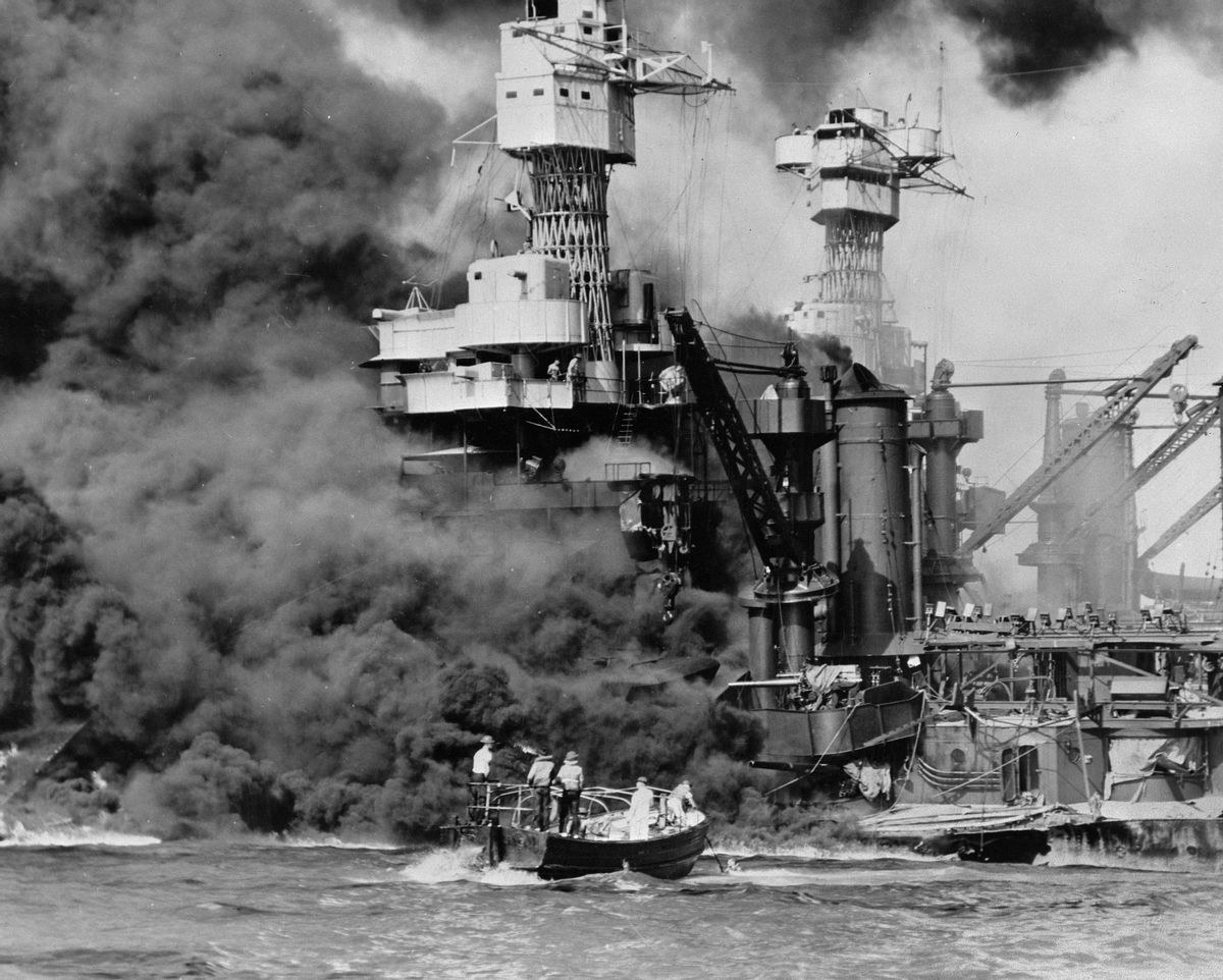 FILE - In this Dec. 7, 1941 photo made available by the U.S. Navy, a small boat rescues a seaman from the USS West Virginia burning in the foreground in Pearl Harbor, Hawaii, after Japanese aircraft attacked the military installation. A few dozen survivors of the Japanese attack on Pearl Harbor plan to gather in Hawaii, Wednesday, Dec. 7, 2016, to remember those killed 75 years ago. (U.S. Navy via AP, File) (AP)