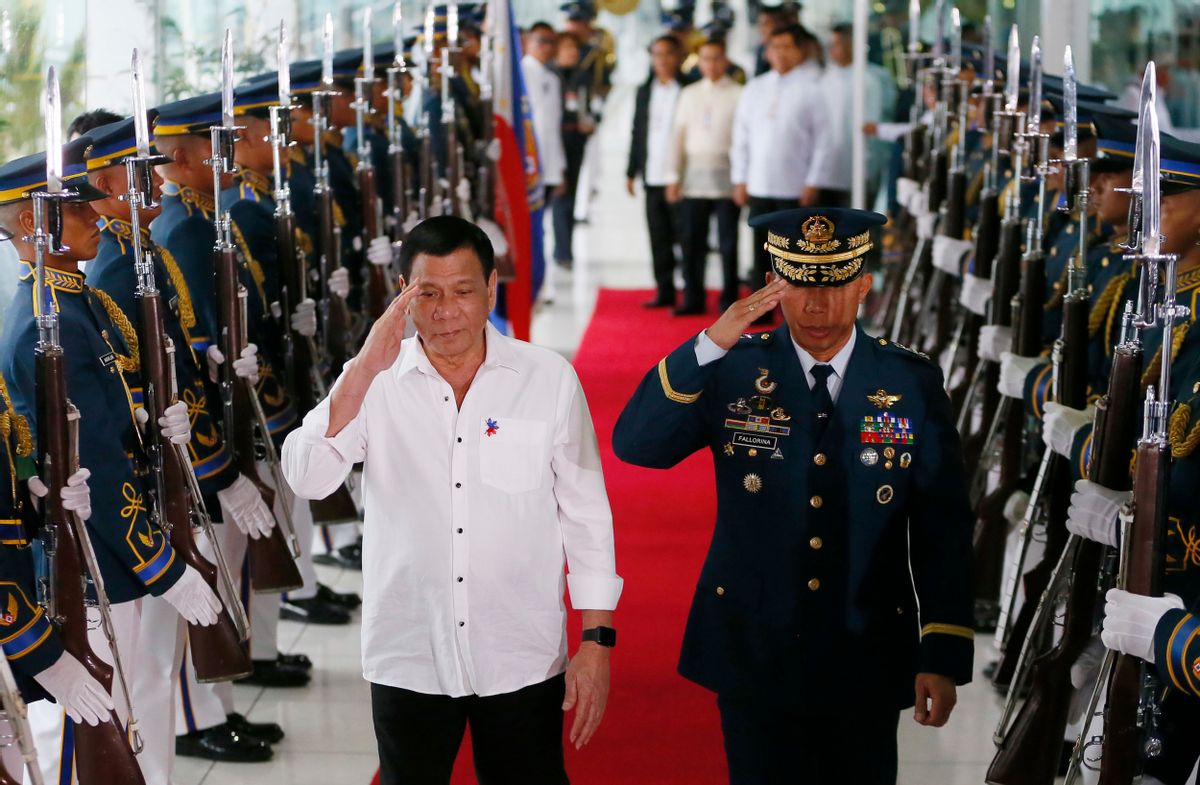 Philippine President Rodrigo Duterte salutes the honor guard prior to his departure for Cambodia and Singapore for official visits to the  ASEAN neighbors, Tuesday, Dec. 13, 2016 at the Ninoy Aquino International Airport in suburban Pasay city south of Manila, Philippines. Duterte said his trip to ASEAN neighbors is in preparation for the upcoming ASEAN summits which the Philippines is hosting late next year. (AP Photo/Bullit Marquez) (AP)