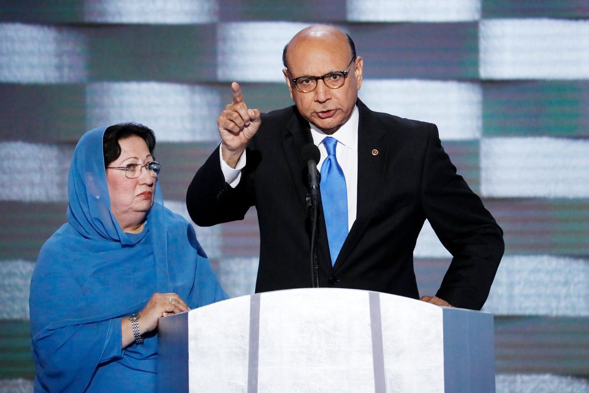 FILE- In this July 28, 2016, file photo, Khizr Khan, father of fallen US Army Capt. Humayun S. M. Khan speaks as his wife Ghazala listens during the final day of the Democratic National Convention in Philadelphia. Khizr Khan's address to Trump at the convention saying: "Have you even read the United States Constitution? ... You have sacrificed nothing and no one," was on Yale Law School librarian’s list of the most notable quotes of 2016. (AP Photo/J. Scott Applewhite, File) (AP)