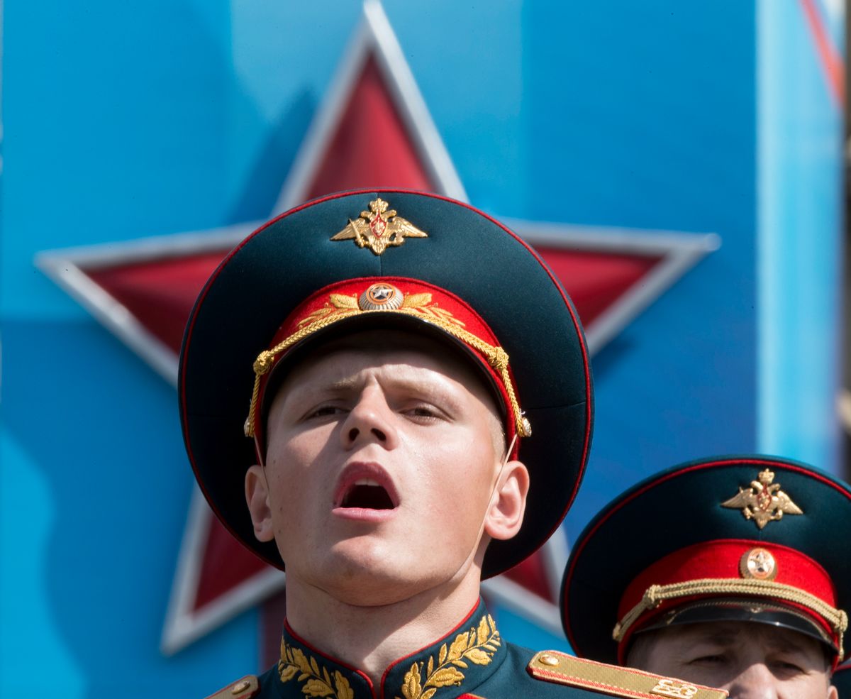 FILE In this file photo taken on Saturday, May 7, 2016, a Russian soldier sings in Red Square during a rehearsal for the Victory Day military parade which will take place at Moscow's Red Square on May 9 to celebrate 71 years after the victory in WWII in Moscow, Russia.  (AP)