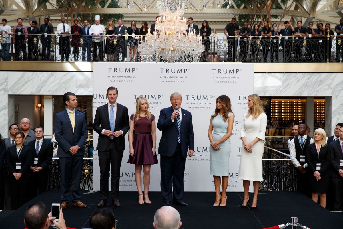 FILE - In this Oct. 26, 2016, file photo, Republican presidential candidate Donald Trump, accompanied by, from left, Donald Trump Jr., Eric Trump, Trump, Melania Trump, Tiffany Trump and Ivanka Trump, speaks during the grand opening of the Trump International Hotel- Old Post Office, in Washington. Donald Trump’s plan to hand control of his business to his children but hold onto ownership is drawing fire from government ethics experts. They say he should sell everything. (AP Photo/ Evan Vucci, File) (AP)
