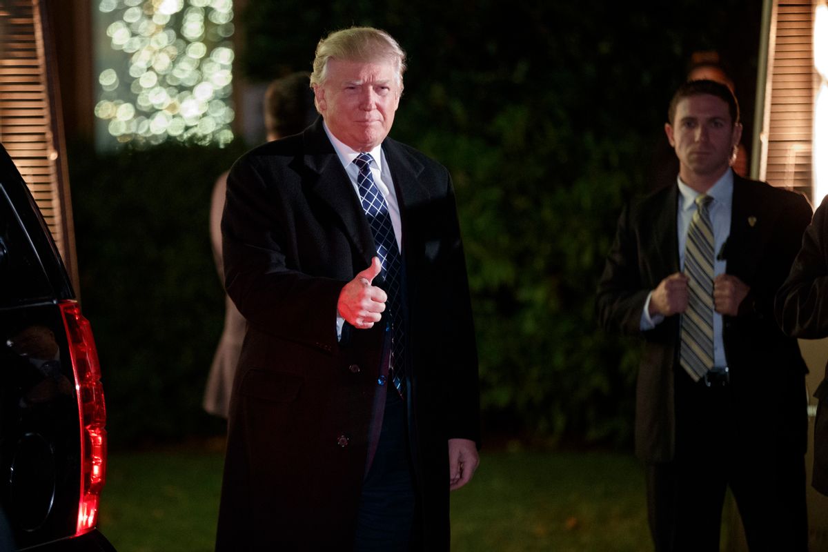President-elect Donald Trump gestures toward reporters as he arrives for a party at the home of Robert Mercer, one of his biggest campaign donors, Saturday, Dec. 3, 2016, in Head of the Harbor, N.Y. (AP Photo/Evan Vucci) (AP)