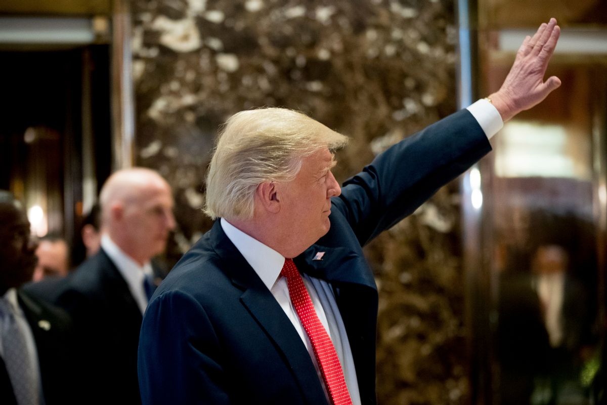 President-elect Donald Trump waves to visitors in the lobby of Trump Tower in New York, Tuesday, Dec. 6, 2016. (AP Photo/Andrew Harnik) (AP)