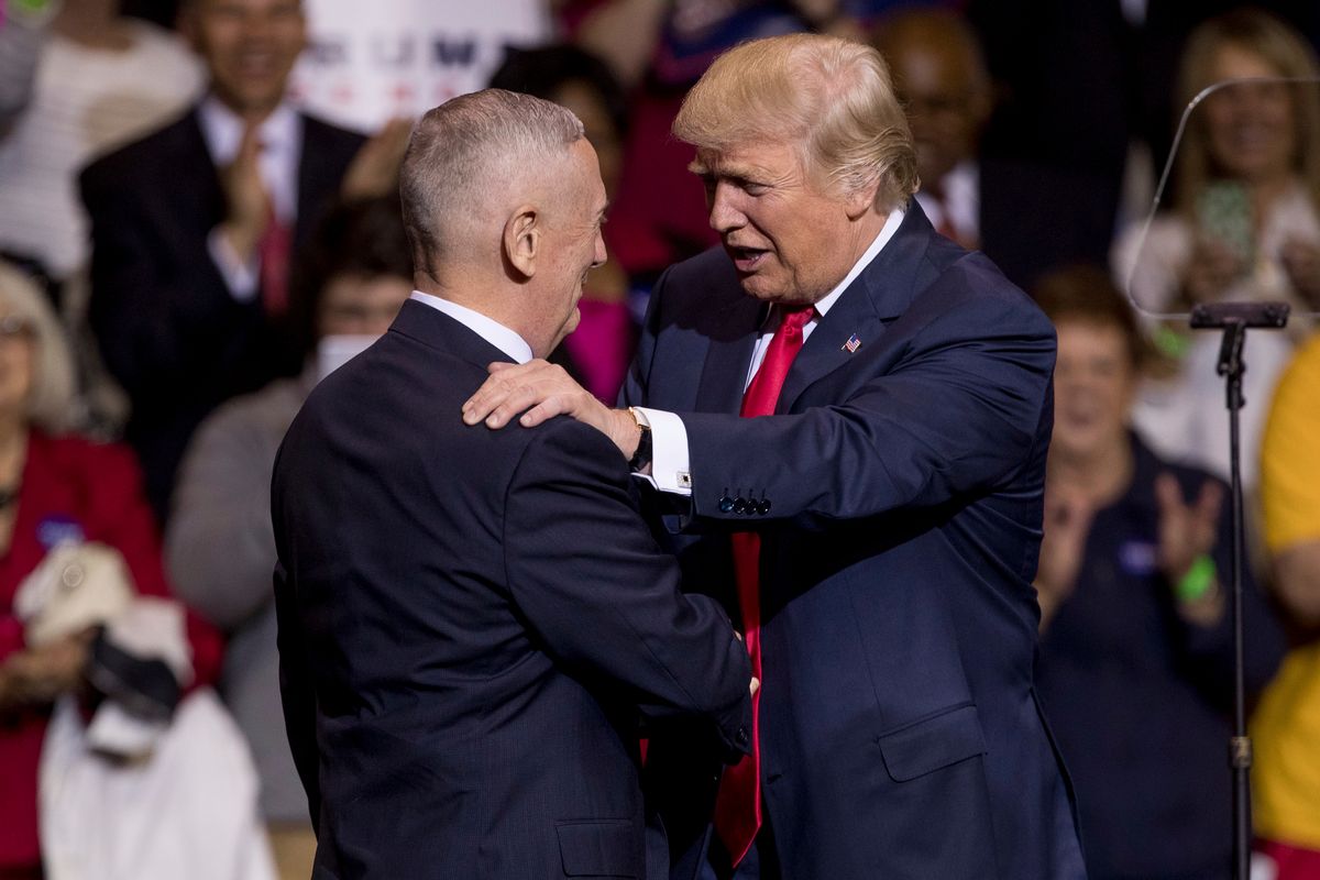 President-elect Donald Trump greets retired Marine Corps Gen. James Mattis, left, as he announces him as his Defense Secretary at a rally at the Crown Coliseum in Fayetteville, N.C., Tuesday, Dec. 6, 2016. (AP Photo/Andrew Harnik) (AP)