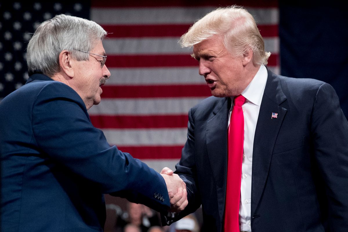President-elect Donald Trump, right, greets Iowa Gov. Terry Branstad, left, as he welcomes him to the stage during a rally at Hy-Vee Hall, Thursday, Dec. 8, 2016, in Des Moines. Branstad has accepted Trump's offer to become U.S. ambassador to China. (AP Photo/Andrew Harnik) (AP)