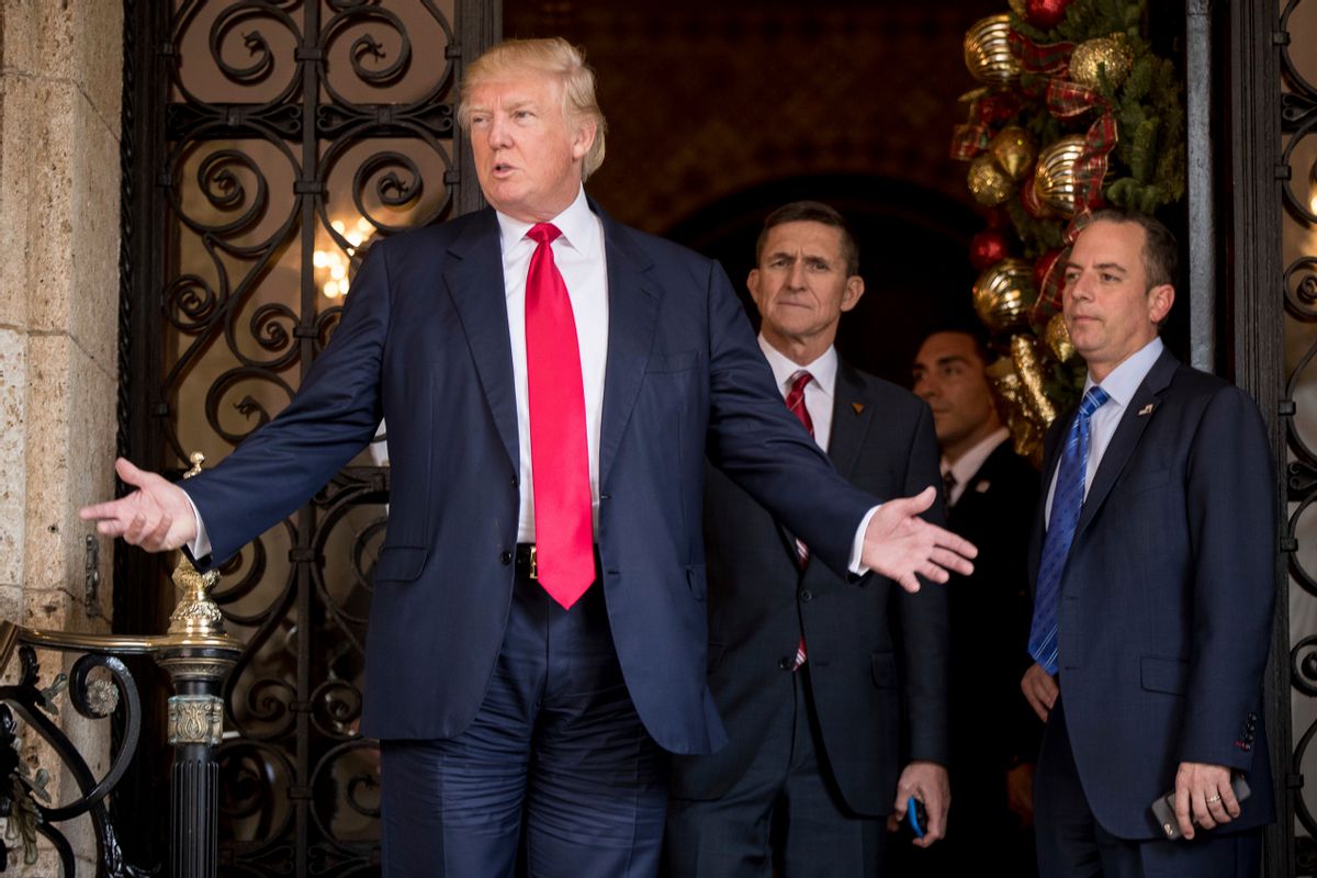 President-elect Donald Trump, left, accompanied by Trump Chief of Staff Reince Priebus, right, and Retired Gen. Michael Flynn, a senior adviser to Trump, center, speaks to members of the media at Mar-a-Lago, in Palm Beach, Fla., Wednesday, Dec. 21, 2016.  (AP)