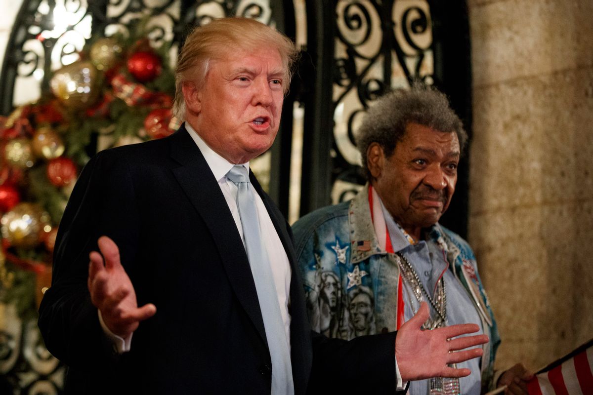 President-elect Donald Trump, left, stands with boxing promoter Don King as he speaks to reporters at Mar-a-Lago, Wednesday, Dec. 28, 2016, in Palm Beach, Fla. (AP Photo/Evan Vucci) (AP)