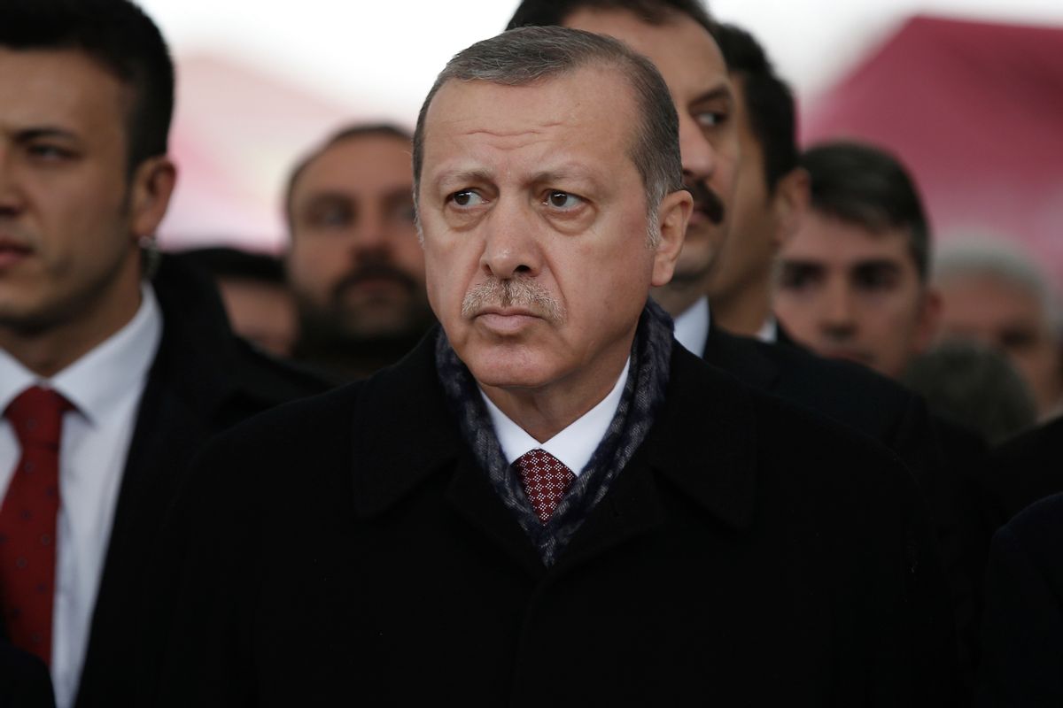 Turkey's President Recep Tayyip Erdogan attends the funeral prayers for police officer Hasim Usta, who was killed with dozens of others late Saturday outside the Besiktas football club stadium Vodafone Arena, in Istanbul, Monday, Dec. 12, 2016. Turkey's police rounded up more than 100 members of a Kurdish political party on Monday as the country mourned the dozens killed in a bombing attack near an Istanbul soccer stadium. Turkish authorities have banned distribution of images relating to the Istanbul explosions within Turkey. (AP Photo/Emrah Gurel) (AP)