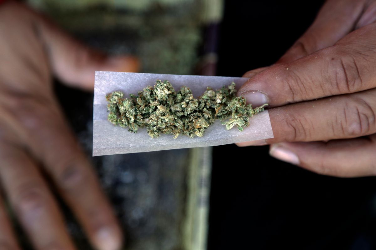 FILE - In this Wednesday, Nov. 9, 2016 file photo, a marijuana joint is rolled in San Francisco. Newly-approved laws in four states allowing the recreational use of marijuana are seen as unlikely to change rules regarding use of the drug in the workplace. (AP Photo/Marcio Jose Sanchez, File) (AP)