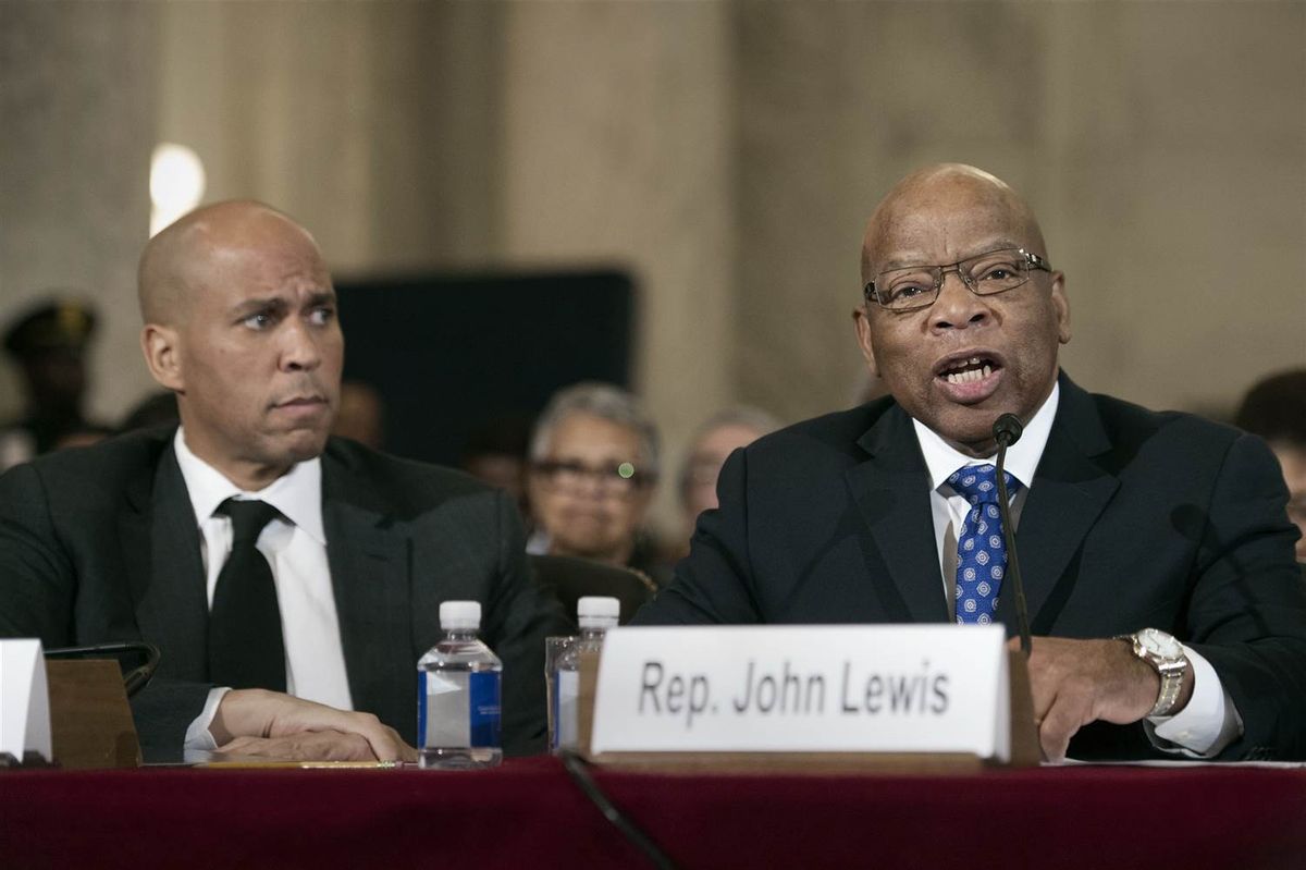 Sen. Cory Session, D-N.J. listens at left as Rep. John Lewis, D-Ga. testifies on Capitol Hill in Washington, Tuesday, Jan. 11, 2017, at the second day of a confirmation hearing for Attorney General-designate, Sen. Jeff Sessions, R-Ala., before the Senate Judiciary Committee (Cliff Owen / AP)