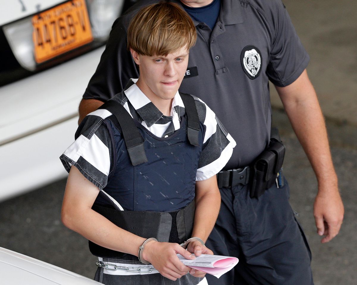 FILE - In this June 18, 2015 file photo, Charleston, S.C., shooting suspect Dylann Roof is escorted from the Cleveland County Courthouse in Shelby, N.C. A federal jury has sentenced Roof to death for killing nine black church members in a racially motivated attack in 2015. (AP Photo/Chuck Burton, File) (AP)