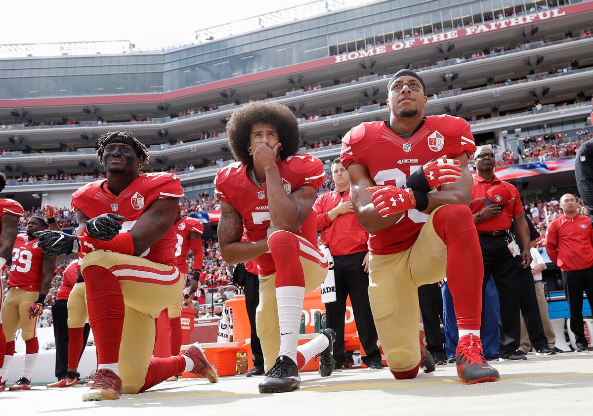 FILE - In this Oct. 2, 2016, file photo, from left, San Francisco 49ers outside linebacker Eli Harold, quarterback Colin Kaepernick and safety Eric Reid kneel during the national anthem before an NFL football game against the Dallas Cowboys in Santa Clara, Calif. During an appearance on Fox News Jan. 3, 2017, former Redskins quarterback Joe Theismann slammed the 49ers' decision to give Kaepernick an award for being an “inspirational and courageous” player. (AP Photo/Marcio Jose Sanchez, File) (AP Photo/Marcio Jose Sanchez, File)