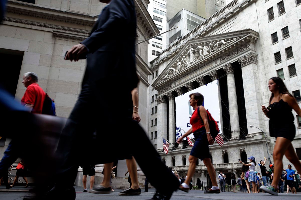 FILE - In this Monday, Aug. 24, 2015, file photo, pedestrians walk past the New York Stock Exchange. While Wall Street celebrates yet another stock market record, surpassing 20,000 on the Dow Jones industrial average on Wednesday, Jan. 25, 2017, most of America has little reason to cheer. The wealthiest one-tenth of Americans owns 80 percent of stock market wealth. (AP Photo/Seth Wenig, File) (AP)