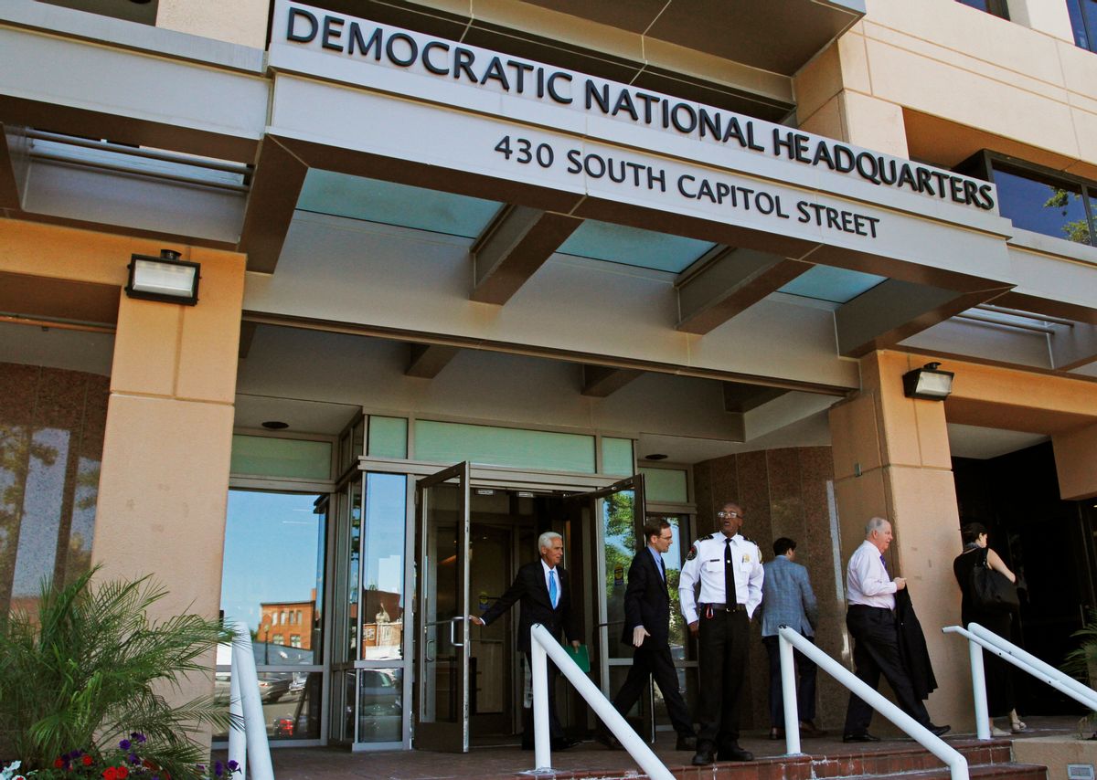 FILE - In this June 14, 2016 file photo, people stand outside the Democratic National Committee (DNC) headquarters in Washington. (AP Photo/Paul Holston, File) (AP)