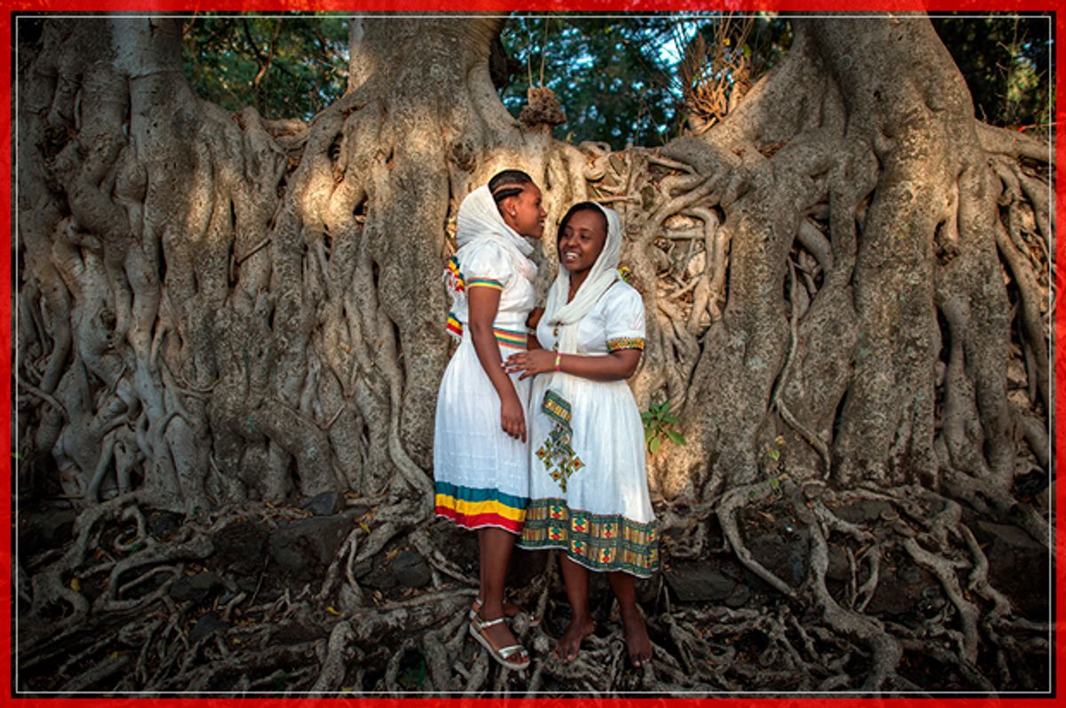 GONDAR, ETHIOPIA - JANUARY 18: Women pose for a photograph in traditional Ethiopian dress during the annual Timkat epiphany celebration on January 18, 2017 in Gondar, Ethiopia. Timkat is the Ethiopian Orthodox Christian festival which celebrates the baptism of Jesus in the Jordan river. During the festival, Tabots, or models of the Ark of the Covenant, are taken from churches around Gondar and paraded through the streets to Fasilides Bath.  (Photo by Carl Court/Getty Images) (Getty Images)