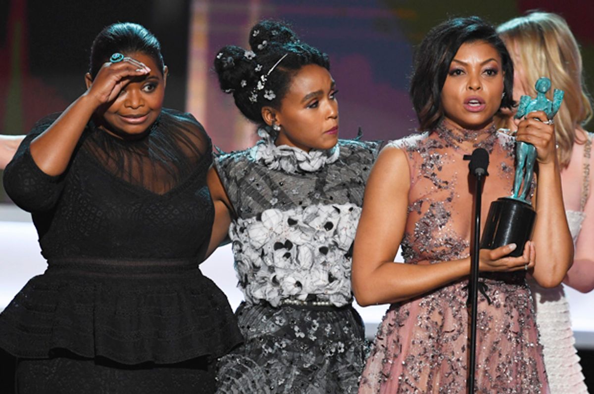 Octavia Spencer, Janelle Monae and Taraji P. Henson accept Outstanding Performance by a Cast in a Motion Picture for 'Hidden Figures' at the Screen Actors Guild Awards, January 29, 2017 in Los Angeles.   (Getty/Kevin Winter)