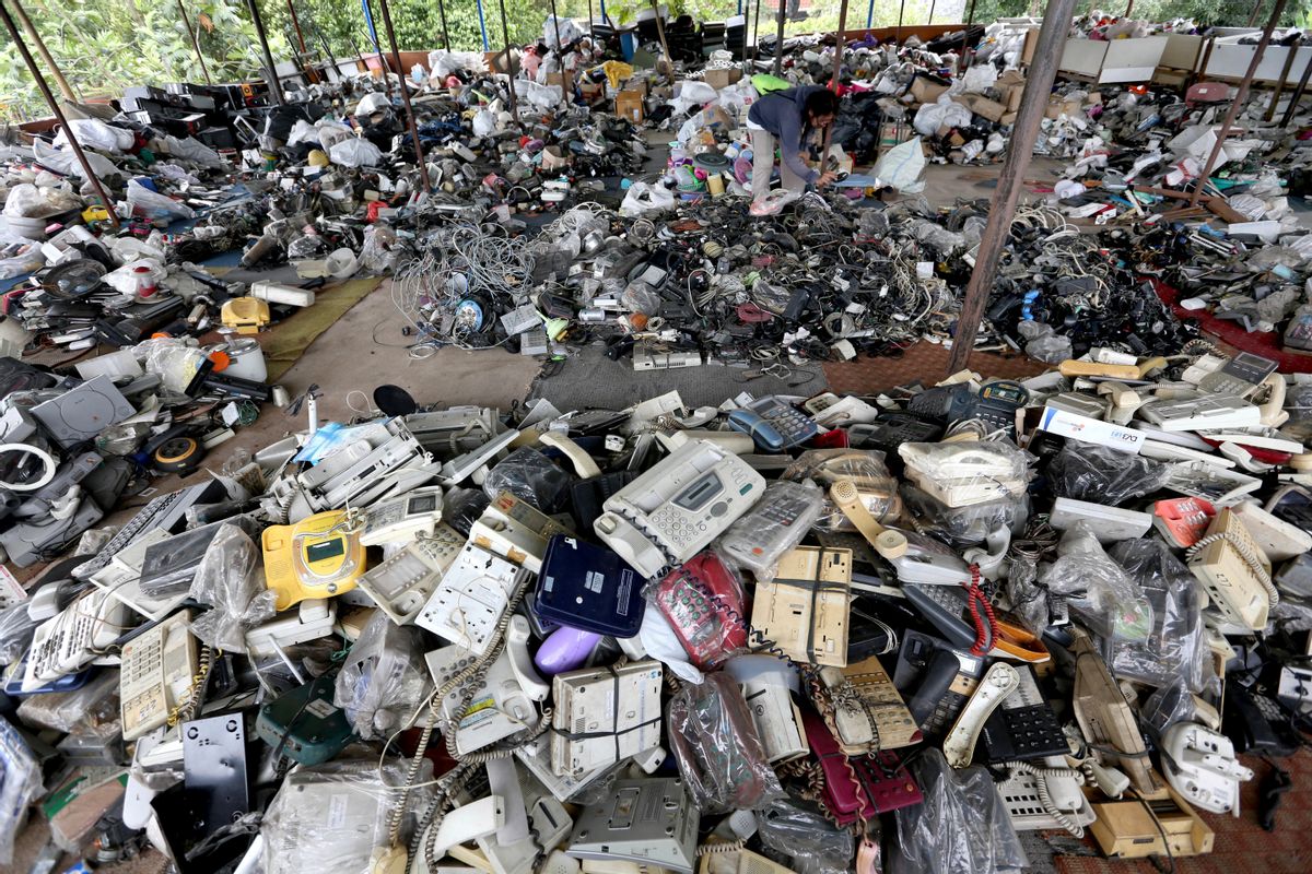In this Friday, Jan. 13, 2017 photo, a customer browses through used items at a flea market on the outskirts of Jakarta, Indonesia. The waste from discarded electronic gadgets and electrical appliances has increased by two-thirds in East Asia over five years, posing a growing threat to health and the environment unless proper disposal becomes the norm. The United Nations University says China is the biggest culprit with its electronic waste more than doubling. (AP Photo/Tatan Syuflana) (AP)