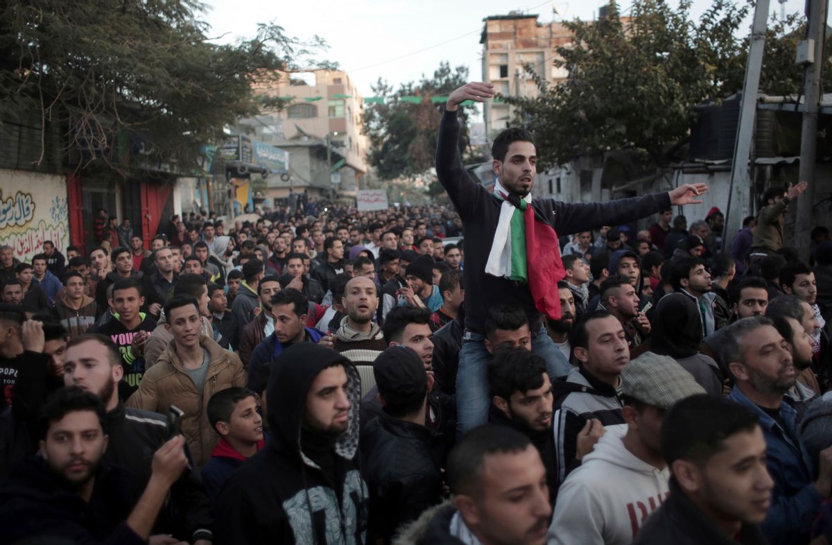 Palestinians chant slogans during a demonstration against the chronic power cuts in Jabaliya refugee camp, Northern Gaza Strip, Thursday, Jan. 12, 2017.  (AP Photo/ Khalil Hamra) (AP)