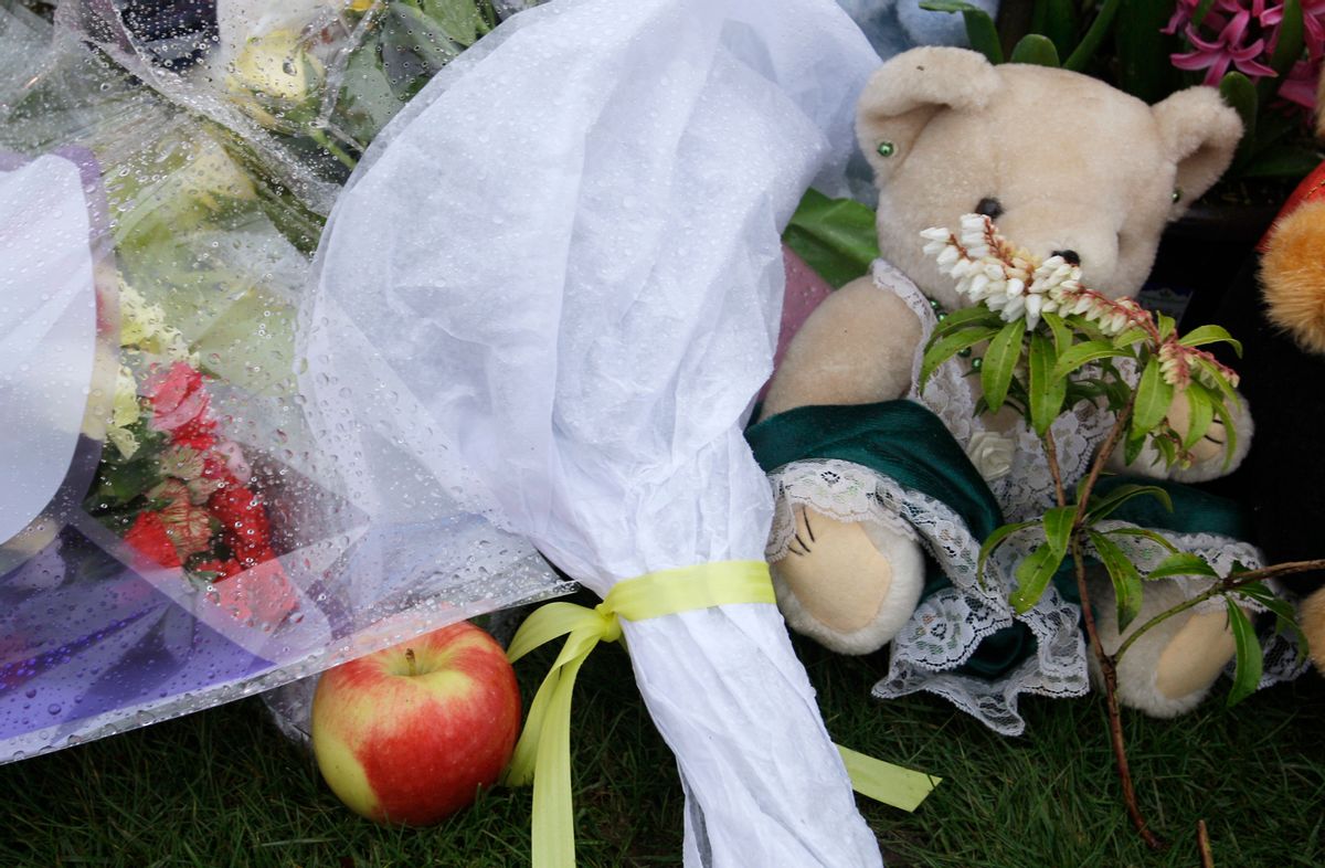 FILE - In this Feb. 26, 2010 file photo, an apple, stuffed animals, and flowers are among the items placed at a growing memorial to slain teacher Jennifer Paulson across the street from Birney Elementary School in Tacoma, Wash. When the economy tanks, school shootings rise, unlike other violent crime, a new study finds. A multi-disciplinary team of researchers at Northwestern University analyzed data from 379 shootings in schools, not just mass shootings or gang involved ones,  between 1990 and 2013 and found an interesting correlation between changes in national and local unemployment rates and how frequent the shootings happen.
 (AP Photo/Ted S. Warren, File) (AP)