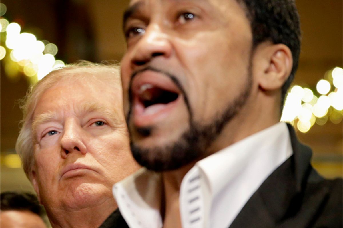 Republican Presidential candidate Donald Trump listens at left as Pastor Darrell Scott talks to reporters in New York   (AP/Seth Wenig)