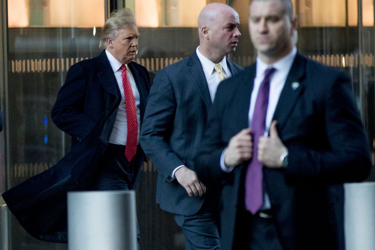 President-elect Donald Trump, left, departs a meeting at the Condé Nast offices at One World Trade Center in New York, Friday, Jan. 6, 2017. (AP Photo/Andrew Harnik) (AP)