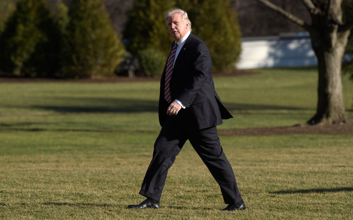 President Donald Trump walks on the South Lawn of the White House in Washington, Thursday, Jan. 26, 2017, after returning from a trip to Philadelphia.  ((AP Photo/Susan Walsh))